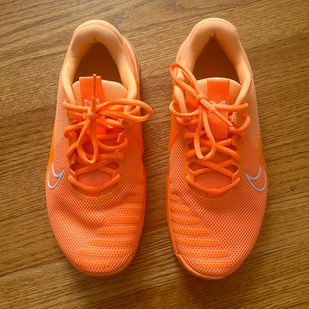 Orange Nike Metcon sneakers